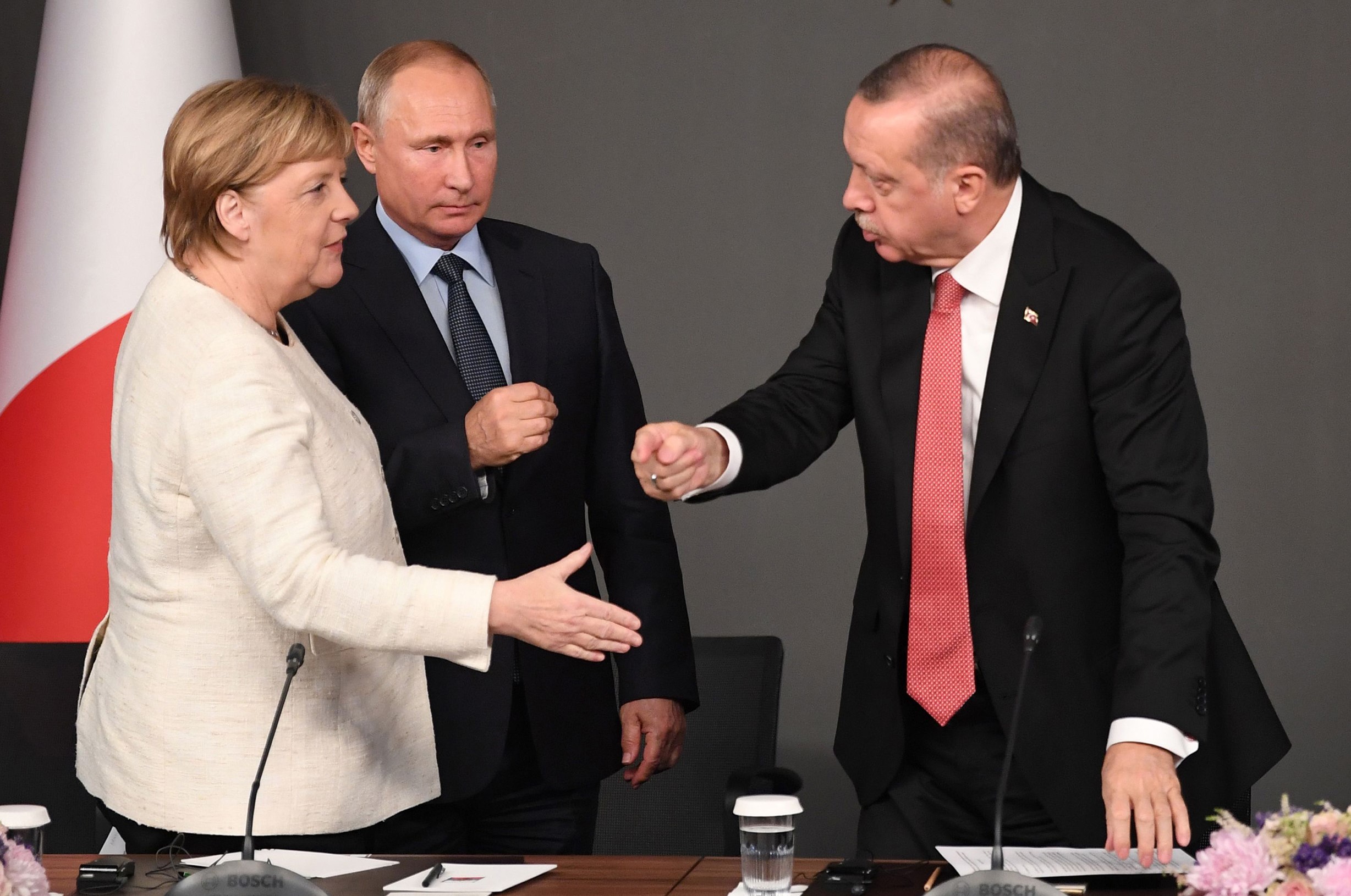 (From L) German Chancellor Angela Merkel,  Russian President Vladimir Putin, Turkish President Recep Tayyip Erdogan and French President Emmanuel Macron, leave after a conference during a summit called to attempt to find a lasting political solution to the civil war in Syria which has claimed in excess of 350 000 lives, at Vahdettin Mansion in Istanbul, on October 27, 2018. - The leaders of Turkey, Russia, France and Germany are set to meet in Istanbul to try to find a lasting political solution to the Syrian civil war and salvage a fragile ceasefire in a rebel-held northern province. (Photo by OZAN KOSE / AFP)        (Photo credit should read OZAN KOSE/AFP via Getty Images)